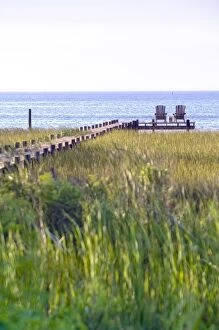 Wooden pier and chairs, Apalachicola Bay, Florida Panhandle, USA