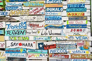 Wooden plaques of visiting boats to the Paradise Beach Club, Carriacou Island, Grenada, Caribbean