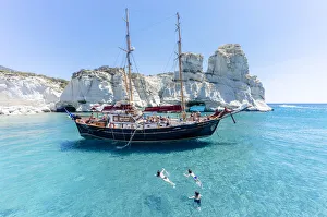 Wooden Sailing boat in Kleftico, Milos Island, Cyclades, Greece Wooden Sailing boat in Kleftico, Milos Island, Cyclades, Greece