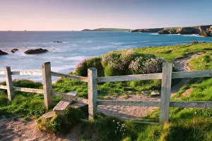 Wooden stile on Cornish clifftops near Porthcothan Bay, South West Coast Path long