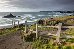 Wooden stile on the South West Coast Path long distance footpath near Porthcothan Bay