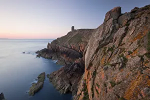 WWII German Observation tower and the rocky northwest coastline of Jersey, Channel WWII German Observation tower and the rocky northwest coastline of Jersey, Channel