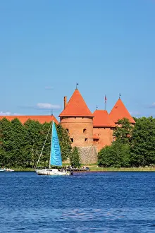 Brick Gothic Prints: Yacht in front of Trakai Island Castle, Trakai, Lithuania