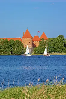 Brick Gothic Prints: Yacht in front of Trakai Island Castle, Trakai, Lithuania