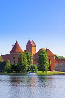 Brick Gothic Prints: Yacht in front of Trakai Island Castle, Trakai, Lithuania