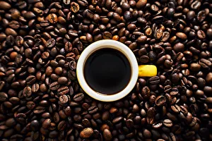 Caffeine Prints: Yellow cup of coffee with coffee beans