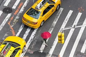 Umbrella Gallery: Yellow taxi cabs & crossing, overhead view, New York, Manhattan, New York, USA