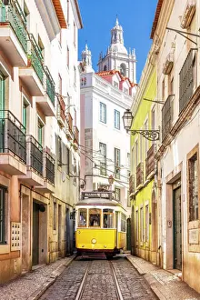 Train Prints: Yellow Tram 28 in the Streets of Lisbon Alfama District Lisbon, Portugal
