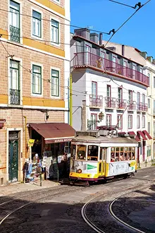 Alfama Prints: Yellow Tram 28 in the Streets of Lisbon Alfama District Lisbon, Portugal