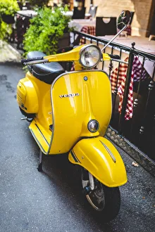 Yellow Vespa in Modena historic city. Modena old town, Emilia Romagna, Italy