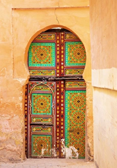North African Prints: Yellow wall and brightly painted wooden door, Meknes, Morocco