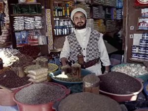 Yemen Collection: A Yemeni trader at his market stall in the old Suq