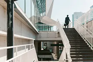 Steel Prints: Yokohama businessman ascends stairs to modern building