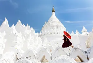 Wall Prints: Young Buddhist monk running along a wall at Hsinbyume Pagoda