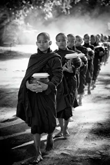 Old Bagan Prints: Young Buddhist monks collecting alms on the streets of Old Bagan, Myanmar