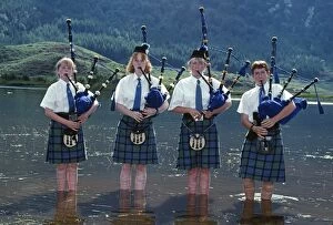 Play Gallery: Young pipers cooling down in the loch during a break