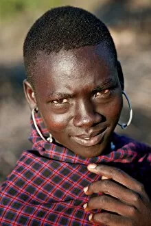 East Pokot District Collection: A young Pokot warrior with large round earrings. The Pokot are pastoralists speaking a Southern
