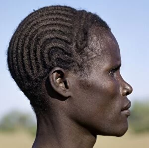 Rift Valley Collection: A young Turkana man with a braided hairstyle