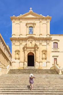 Architectures Prints: Young woman climbing the stairs of San Francesco all Immacolata church, Noto