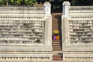 Umbrella Gallery: Two young women sitting at stairs at Khan Taw Mingalar, Mandalay, Mandalay Region